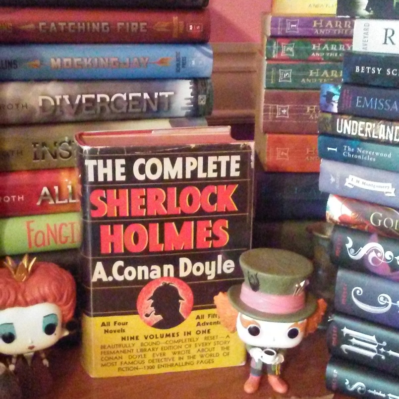 Here is the Mad Hatter and Queen of Hearts standing in front of a behemoth Sherlock Holmes collection that could literally murder my face...